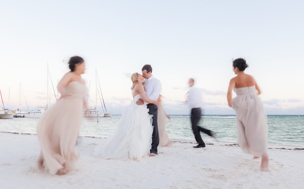 Wedding couple on beach kissing in riviera maya wedding