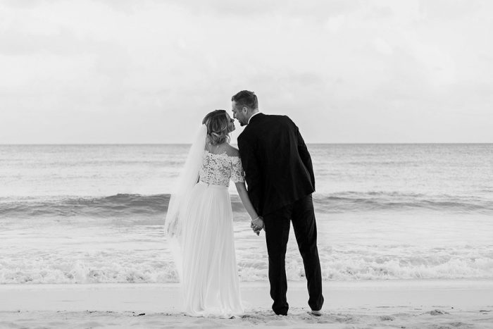 How many wedding photographers do you need? this couple used one and got this amazing photograph of them kissing on the beach in Cancun.