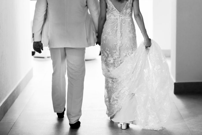 Close up of bride and groom walking to wedding reception in Mexico.