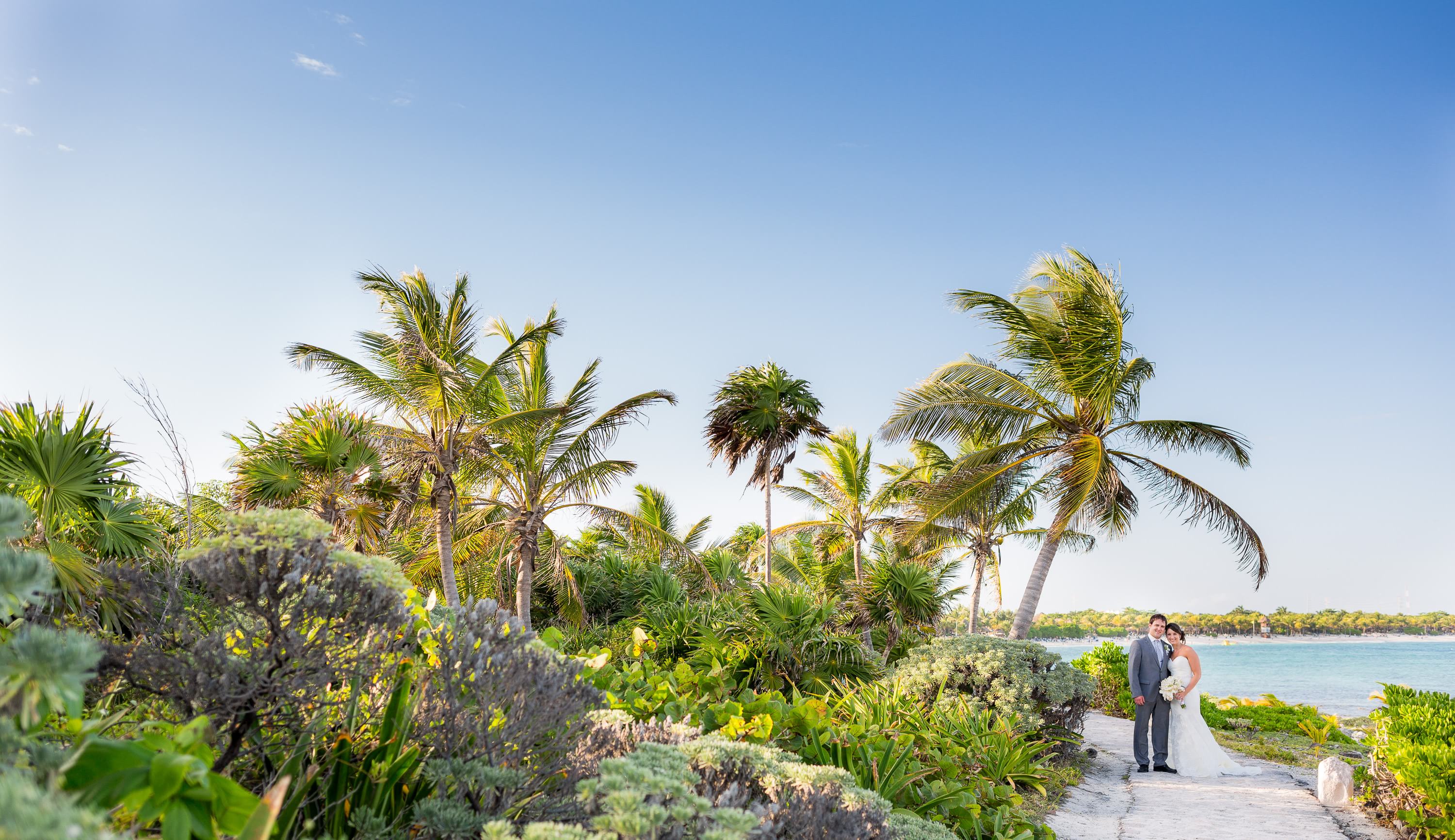 Couple besides the ocean at Grand Palladium Riviera Maya Wedding