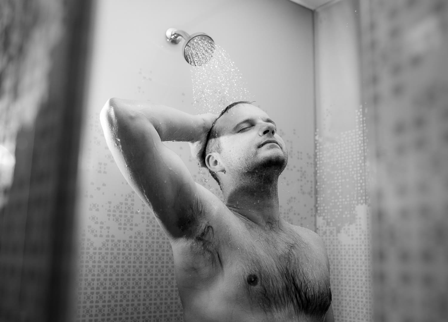 Groom in shower getting ready.