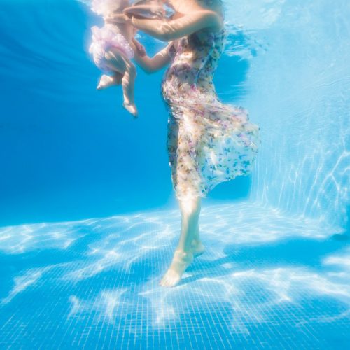 baby and feet underwater in Mexico