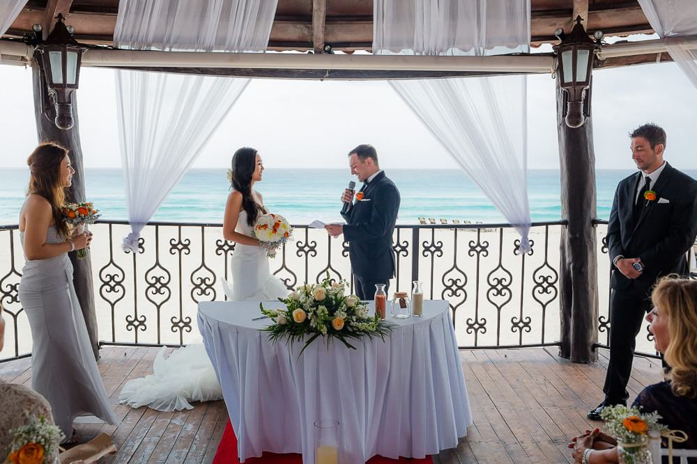 bride and groom at their ceremony at Hyatt Zilara Cancun Wedding