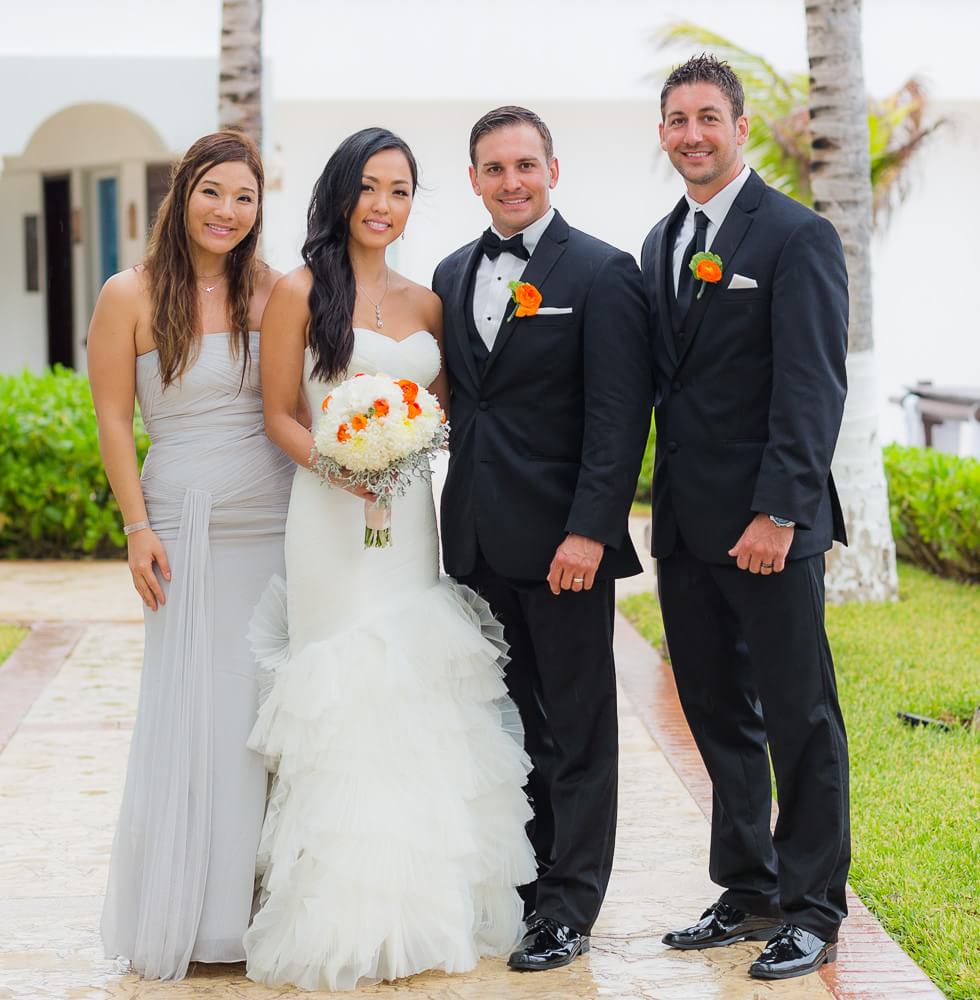 Happy couple with guests at Hyatt Zilara Cancun Wedding