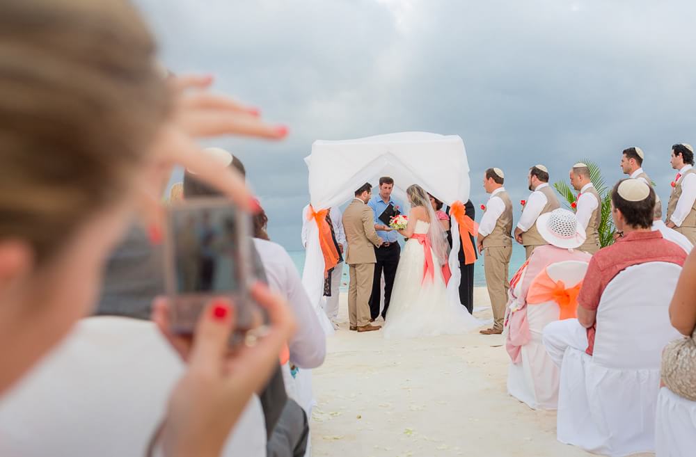 Couple under huppa at wedding