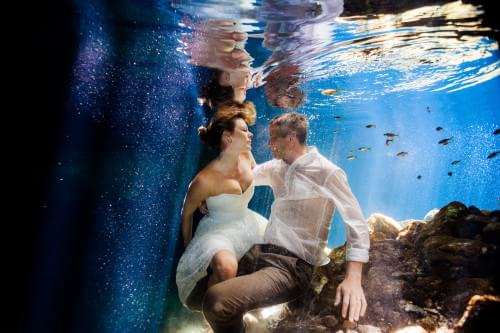 Couple underwater in Mexican Cenote in Trash the dress