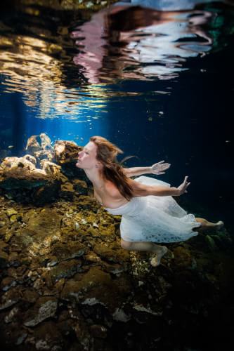 Bride in Cenote trash the dress