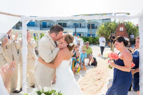 couple kissing at the beach at their Royal Playa del Carmen Wedding