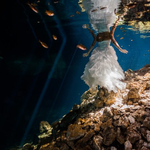 bride and dress underwater in Trash the Dress