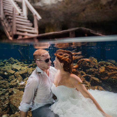 Bride and groom about to kiss underwater in Mayan cenote Trash the Dress session
