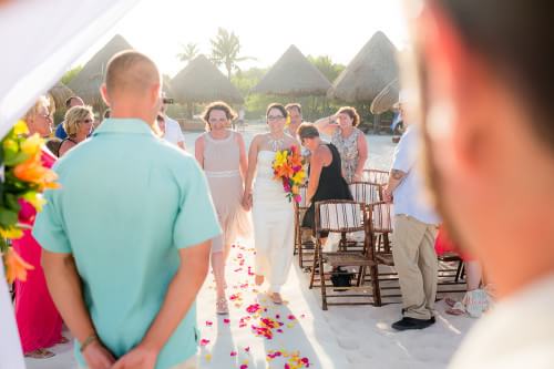Amy walking down the aisle at her Destination Beach Wedding at Iberostar Lindo Mexico