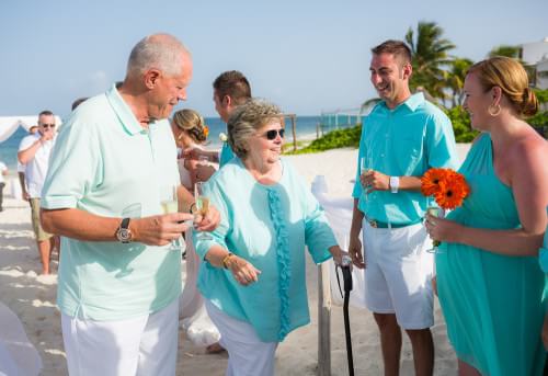 Couple's family toasting at Ocean Coral and Turquesa Resort