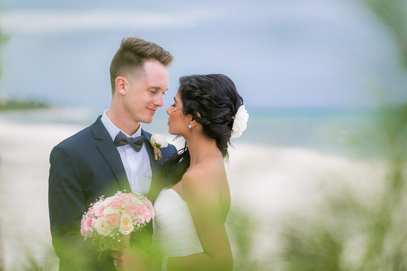 Bride and groom on beach in Riviera Maya