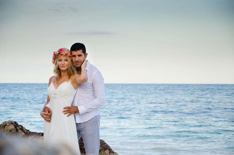 Bride and groom on beach in Tulum