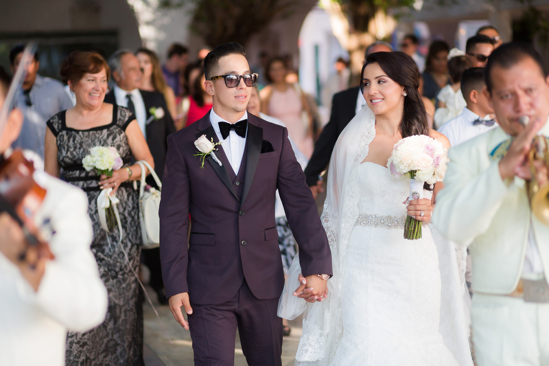 Bride and groom walking down street in Playa del carmen