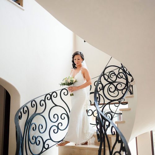 Bride walking down staircase