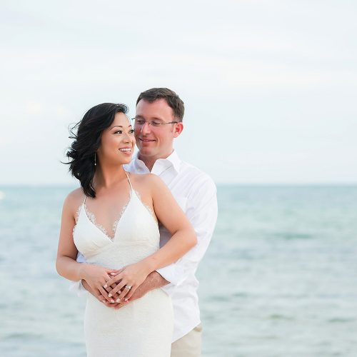 Bride and groom on beach in Tulum