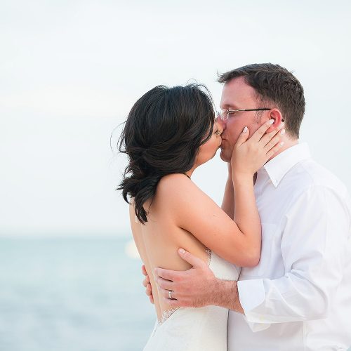 Bride and groom kissing after wedding in Tulum