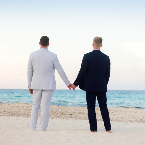Couple holding hands on the beach | Same Sex Wedding Photographer | Dean Sanderson Weddings