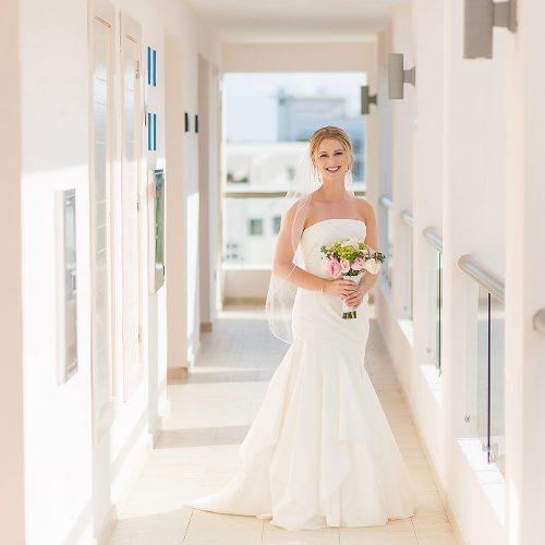 Portrait of bride in hallway at Excellence Playa Mujeres