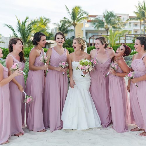 Bridesmaids on beach after wedding at Excellence Playa Mujeres