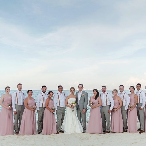 Bridal party on beach after wedding at Excellence Playa Mujeres