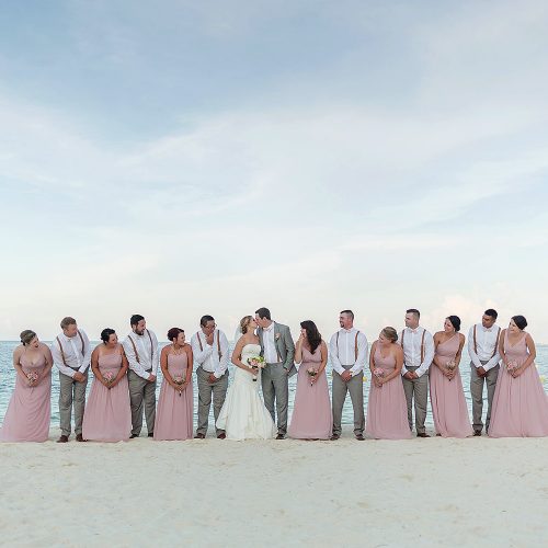 Bridal party on beach after wedding at Excellence Playa Mujeres