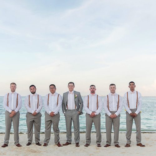 Groomsmen on beach after wedding at Excellence Playa Mujeres