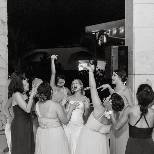 Bridesmaids having fun at Excellence Playa Mujeres wedding reception