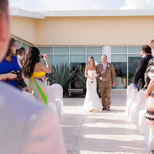 Bride walking down aisle at gazebo ceremony location at NOW Jade Riviera Cancun