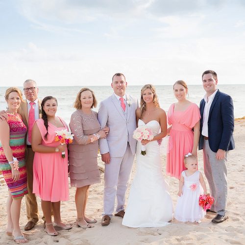 Family on beach at Jade Riviera Cancun wedding