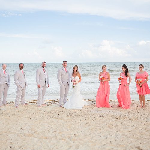 Bridal party on beach with ocean in background at NOW Jade Riviera Cancun