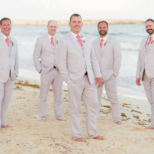 Portrait of groomsmen on beach at NOW Jade Riviera Cancun wedding
