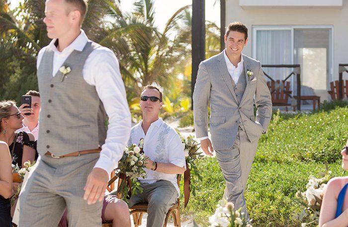 Groom walking down aisle in Tulum