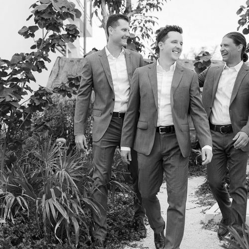 Groomsmen walking at Secrets Akumal Riviera Maya resort