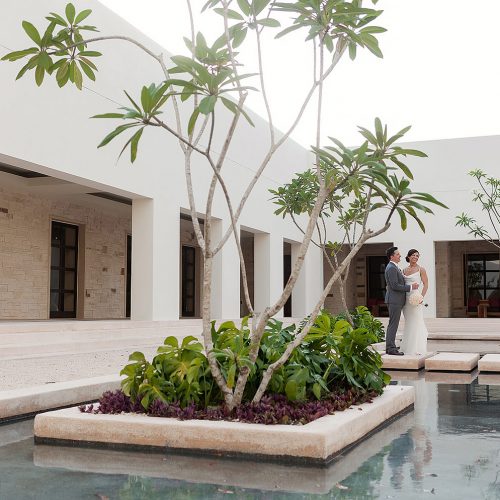 Portrait of bride and groom in garden at Secrets Akumal Riviera Maya