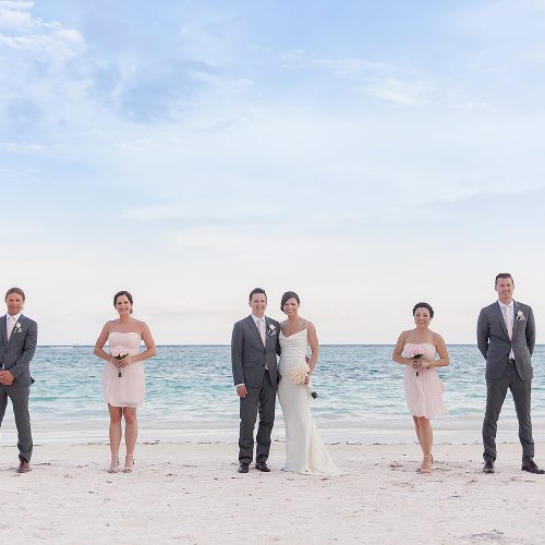 Bridal party on beach at Secrets Akumal Riviera Maya after wedding