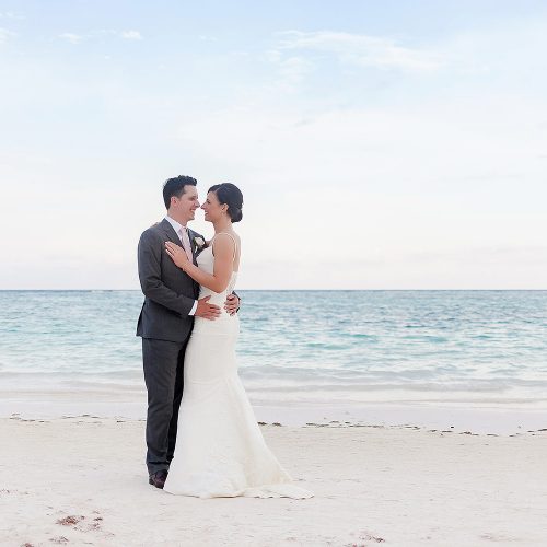 Bride and groom on beach after wedding at Secrets Akumal Riviera Maya