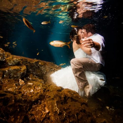 Bride and groom kissing underwater in Trash the Dress, Riviera Maya Mexico