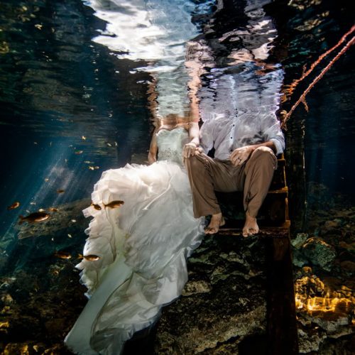 Half of bride and groom underwater Trash the Dress, Riviera Maya