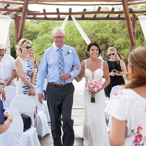 Father of the bride walking her down the aisle at Playa del Carmen Riviera Maya wedding
