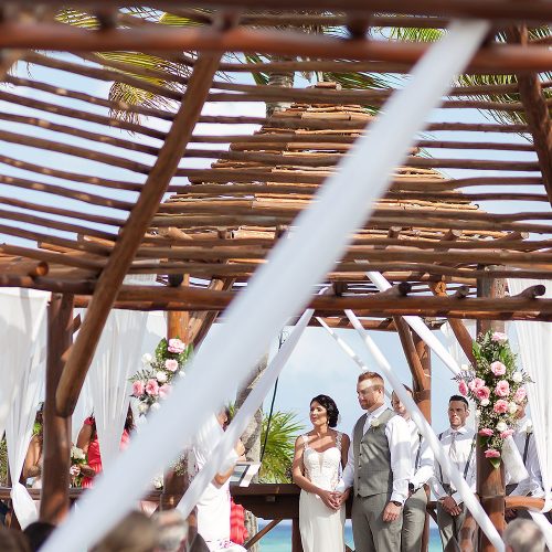 couple portrait under wooden gazebo at Playa del Carmen Riviera Maya wedding