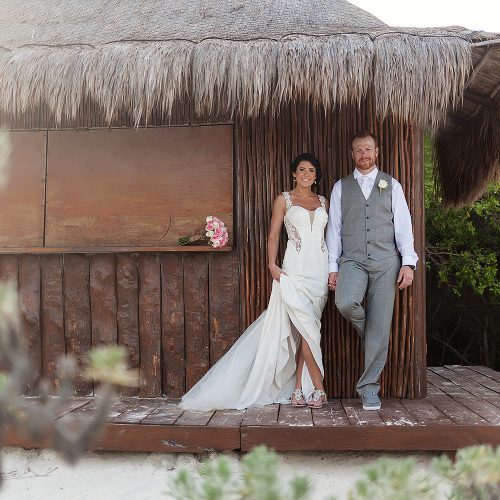 bride and groom under gazeebo for wedding photography at Playa del Carmen Riviera Maya
