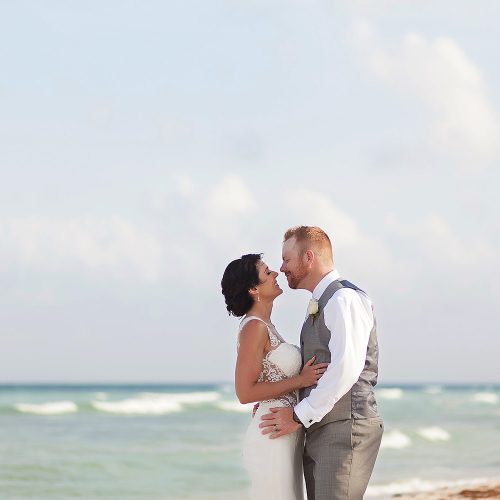 Bride and groom almost kissing on the beach in Playa del Carmen