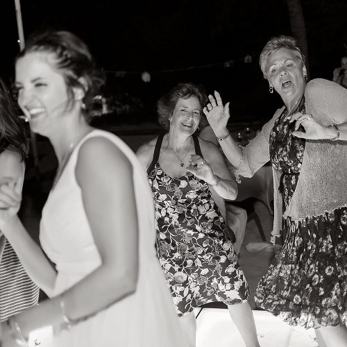 guests having fun in black and white photography at Riviera Maya wedding