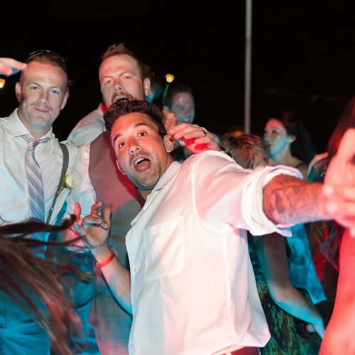 guys posing funny for wedding at Playa del Carmen wedding reception