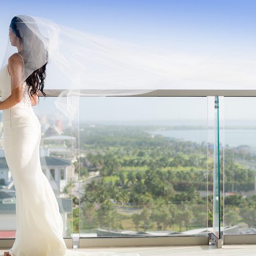 Bride on balcony at Secrets The Vine Cancun