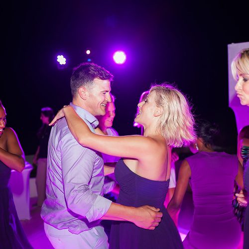 Guest dancing with groom at Live Aqua Cancun wedding reception