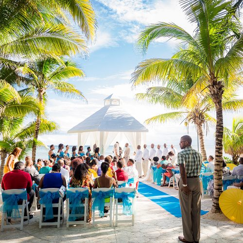 Wedding ceremony with guests at El Dorado Seaside Suites