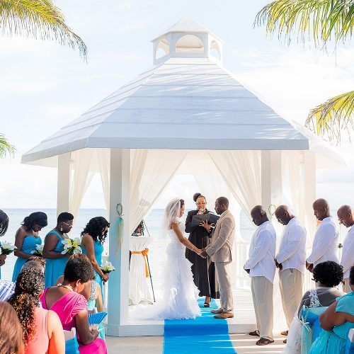 Wedding ceremony at beachside gazebo at El Dorado Seaside Suites